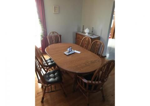 Oak dinner table with chairs and server